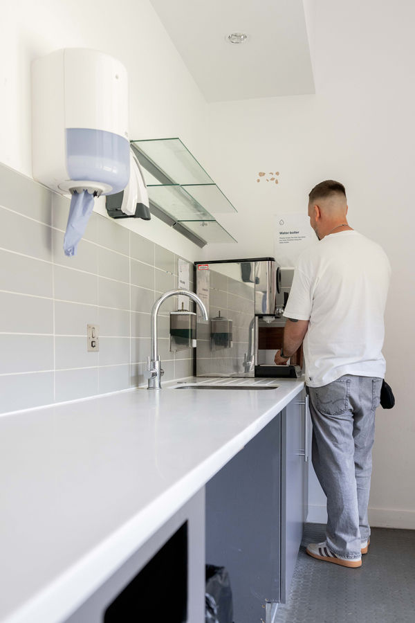 Student using the microwave in the student kitchen