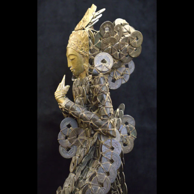 Figure of Dewi Sri, the Rice Goddess, from Java, made of valuable Chinese coins.